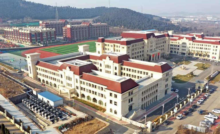 Commercial heat pump heating and cooling systems for large school buildings